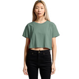 A cropped tee in a muted green colour, featuring a simple design and short sleeves, displayed on a model.