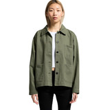An olive green chore jacket featuring a collared neckline and front pockets, worn by a model.