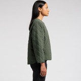 A quilted jacket in olive green, featuring a simple design and a branding logo, viewed from the side.