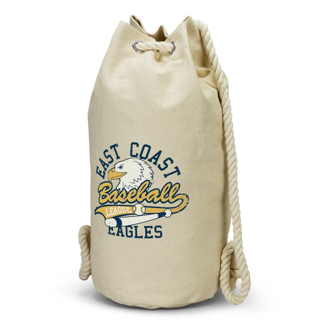 A cream-coloured canvas barrel bag with a rope handle and a logo featuring an eagle and text.