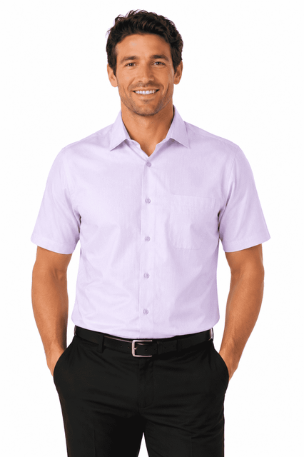A short-sleeve men's shirt in light purple, featuring a pocket and a logo, modelled by a smiling man.