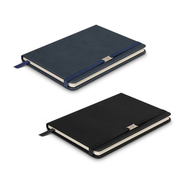 A navy and black Pierre Cardin Nouvelle Notebook with a ribbon bookmark and a silver branding logo. A navy and black Pierre Cardin Nouvelle Notebook with a ribbon bookmark and a silver branding logo.