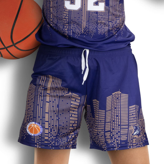 Custom women's basketball shorts in navy blue featuring a city skyline design and a basketball logo. Custom women's basketball shorts in navy blue featuring a city skyline design and a basketball logo.