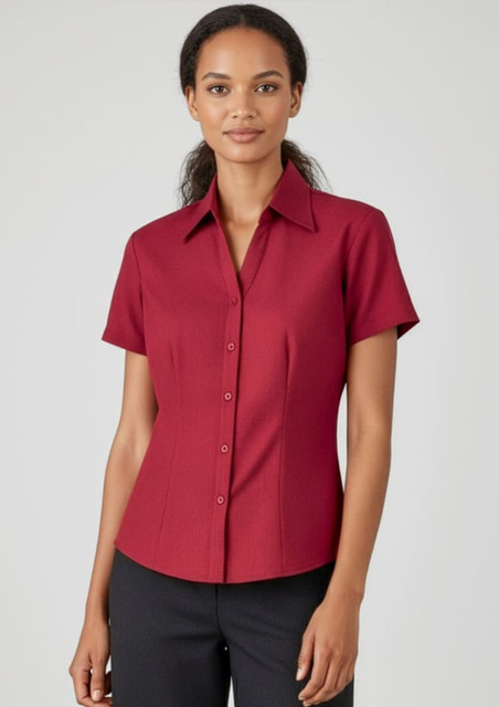 A red short sleeve button-up shirt with a fitted design and a collar. The shirt features buttons down the front.