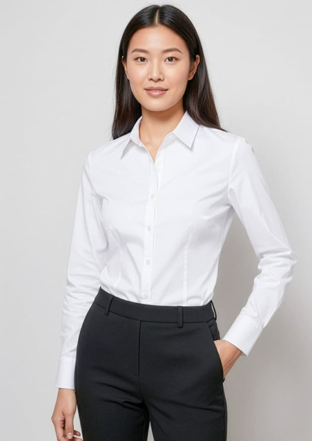 A white long sleeve button-up shirt styled with a classic collar, paired with black trousers. The shirt features branding.