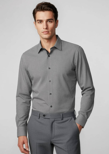 A grey long sleeve button-up shirt with a subtle pattern, paired with tailored grey trousers. The shirt has a logo.