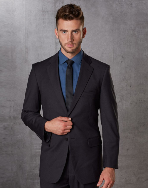 A men's dark grey poly/viscose stretch jacket, styled with a blue shirt and black tie, featuring a subtle logo.