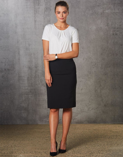 A model wears a black mid-length lined pencil skirt paired with a white top and high heels. The skirt features a subtle stripe pattern. A model wears a black mid-length lined pencil skirt paired with a white top and high heels. The skirt features a subtle stripe pattern.