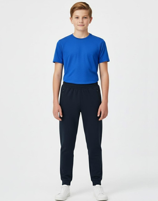A boy wearing a red long-sleeve polo and black poly/cotton terry sweat pants, standing against a plain background.