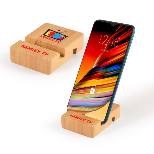 A bamboo phone stand in natural color displaying a smartphone. The stand features a logo design.