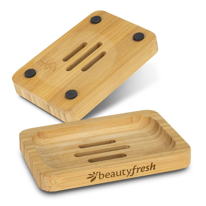A bamboo soap holder with black rubber feet, featuring a channel design and a logo. Comes in a natural bamboo finish.