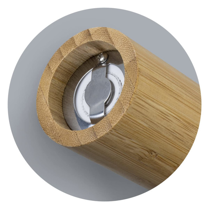 A bamboo pepper mill featuring a stainless steel grinding mechanism and smooth wooden finish. It has a logo inside.