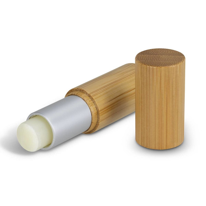 A bamboo lip balm with a silver tip and a wooden exterior, featuring a removable cap.