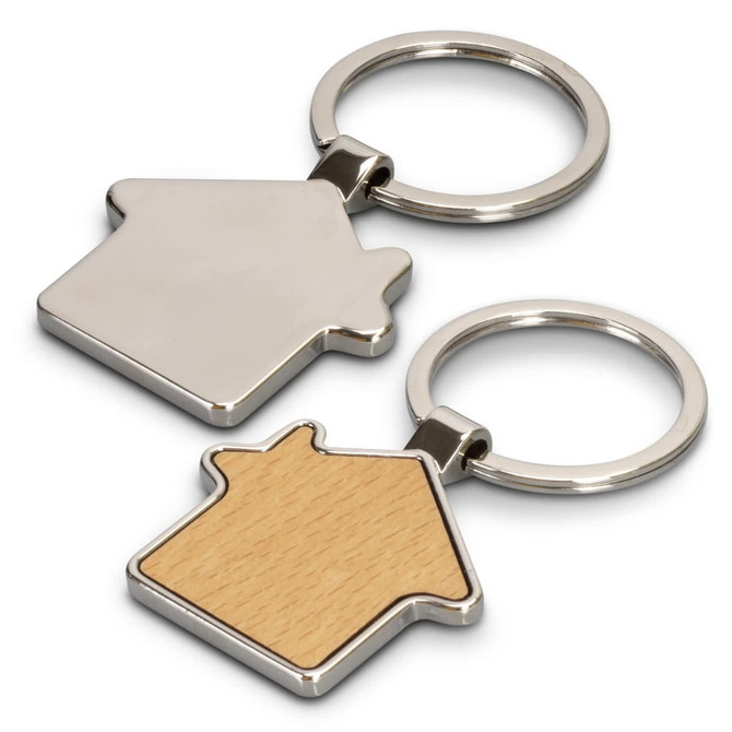 A silver and wooden house-shaped key ring with a keychain loop. The wooden side features a light timber finish.