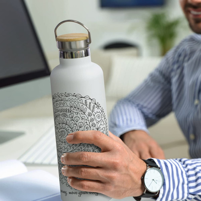 A drink bottle with a frosted white finish and intricate black floral designs, featuring a wooden lid and metal base.
