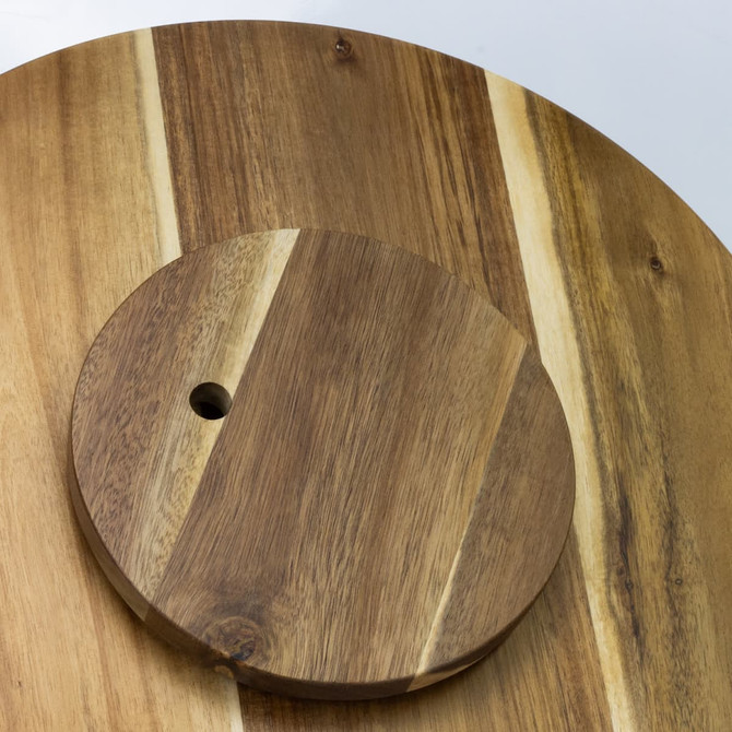A wooden Lazy Susan with a circular design featuring a mix of light and dark wood tones. It has a small hole for easy rotation.