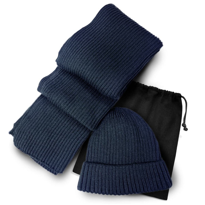 A navy ribbed scarf and beanie set, packaged with a black drawstring bag.