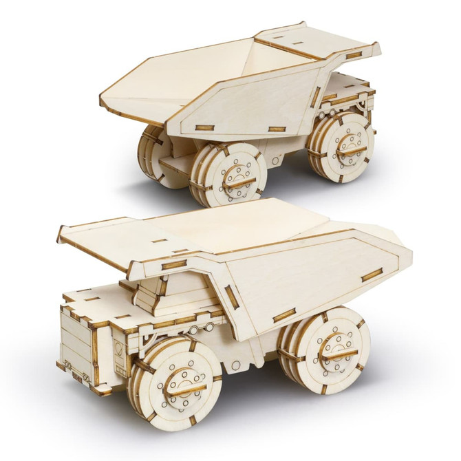 A wooden model of a mining truck, featuring detailed laser-cut designs and a natural wood finish. It has working wheels.