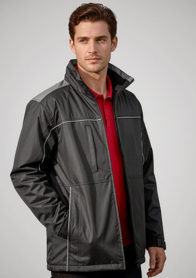 A man models a black unisex reactor jacket with grey accents, featuring zip pockets and a collar.