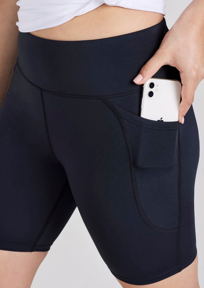 A pair of women's black bike shorts featuring a side pocket for a phone. The shorts have a high waistband for comfort.