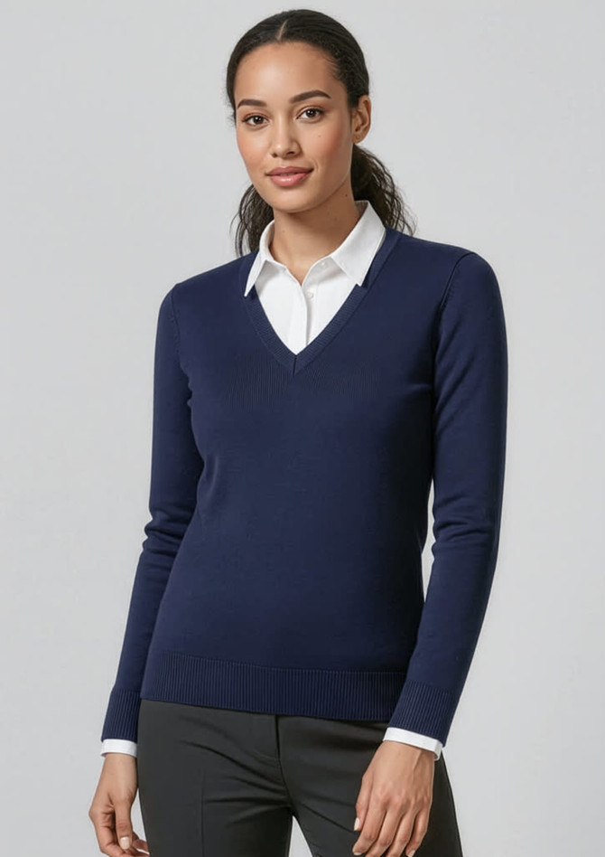 A women's navy V-neck knitted pullover worn over a white collared shirt, featuring a fitted design and long sleeves.
