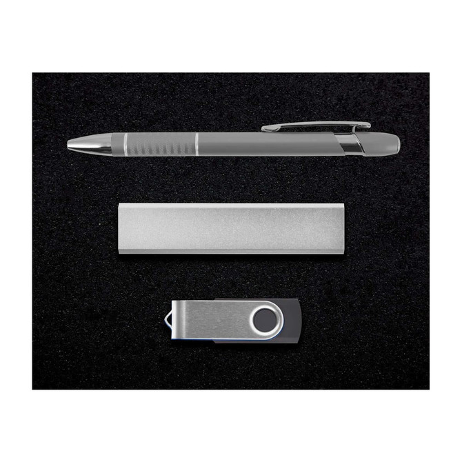 A silver pen, a sleek metal bar, and a silver USB drive arranged on a black background.