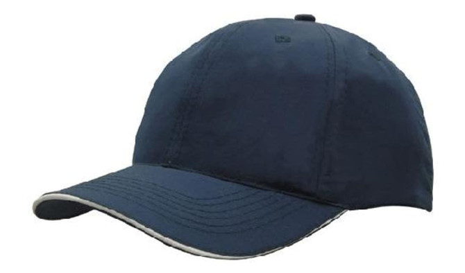 A navy cap with a curved brim, featuring a woven fabric design and a wind strap with a clip.