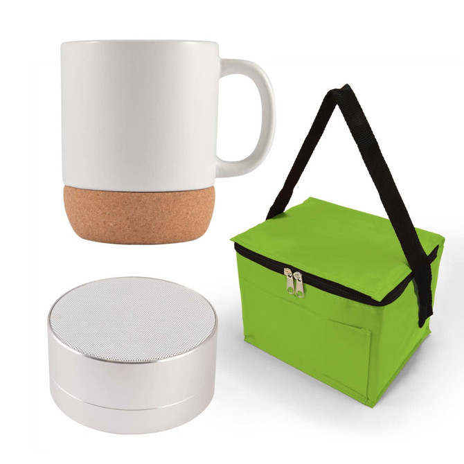 A coffee mug with a cork base, a small round speaker, and a green insulated carrying bag.