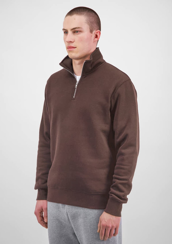 A brown 1/4 zip jumper worn by a male model, featuring long sleeves and a casual fit.