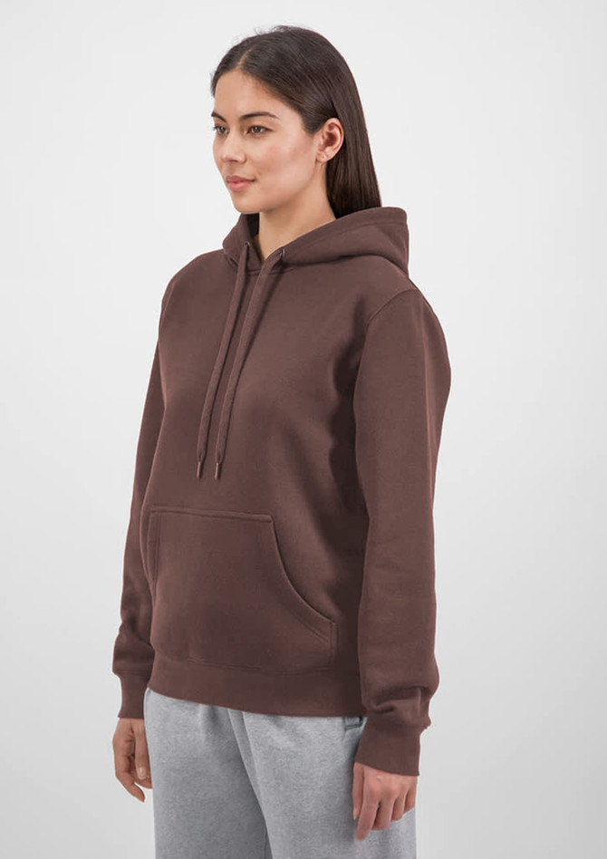 A brown hoodie with a front pocket and drawstrings, featuring a logo. Model wearing it with grey pants.