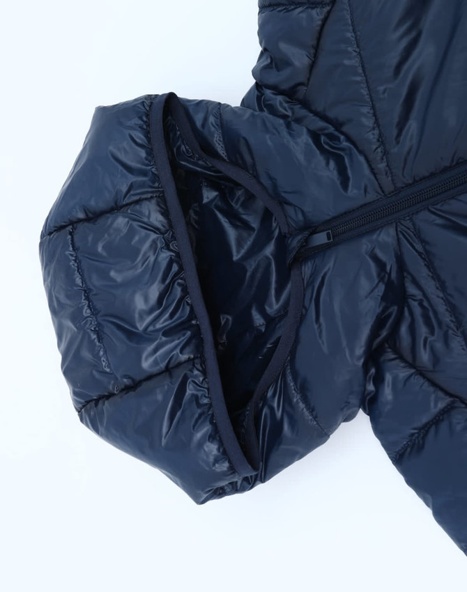 A navy hooded puffer jacket featuring a zip closure and a soft lining, with a subtle logo on the fabric.