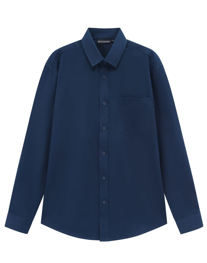 A navy long-sleeve shirt made from a cotton blend, featuring a button-up front and a chest pocket.