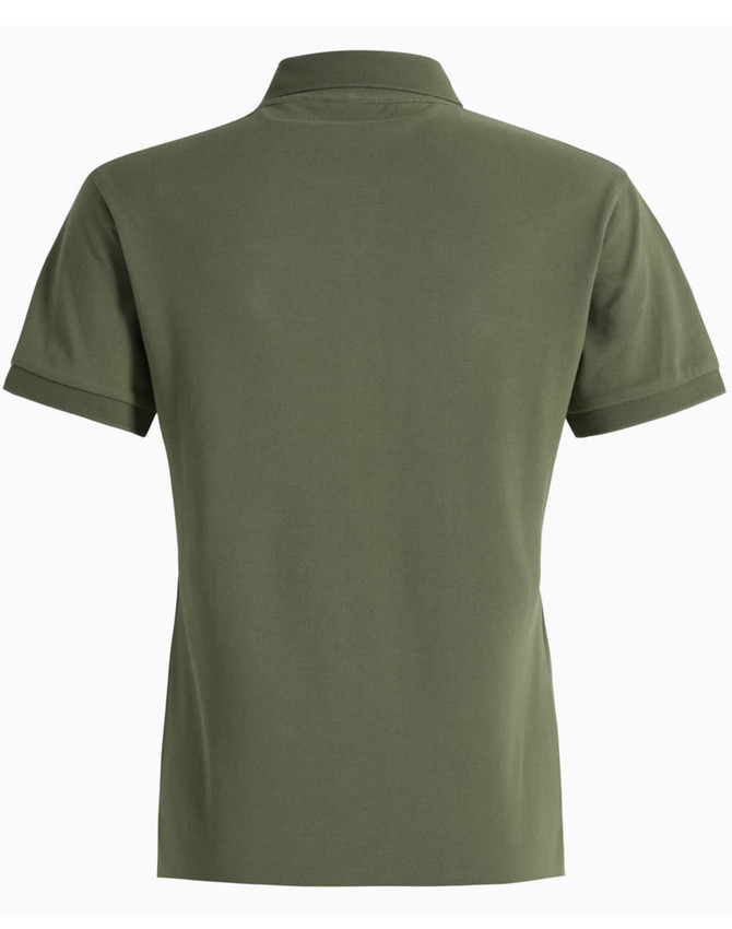 A green ladies' ultrafine cotton pique polo featuring a simple design with a collar and short sleeves.
