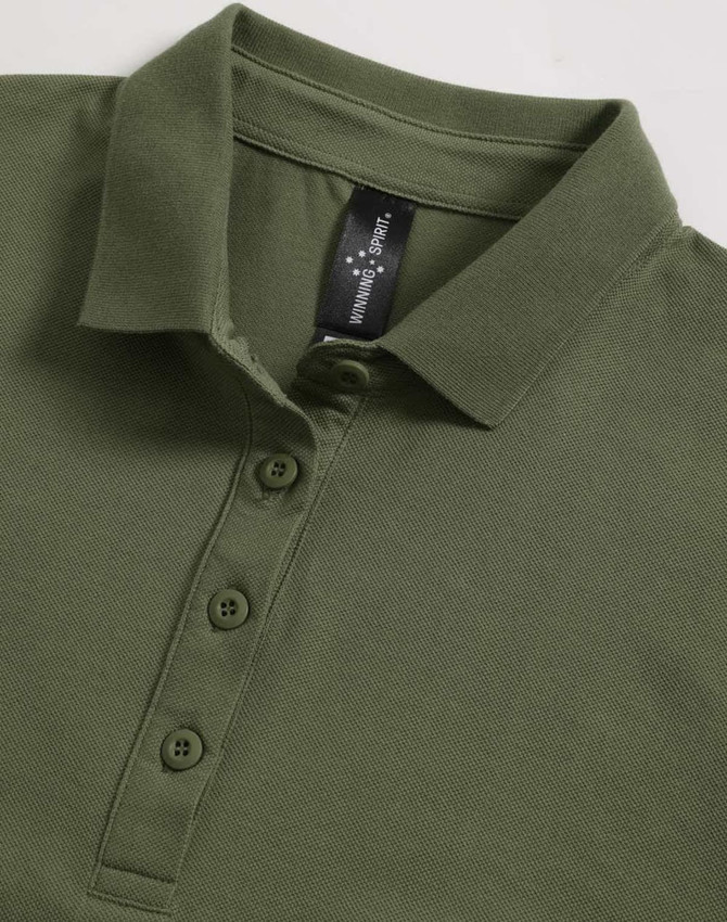 A green ladies polo shirt with a collared neck and a button placket, featuring a logo tag inside.