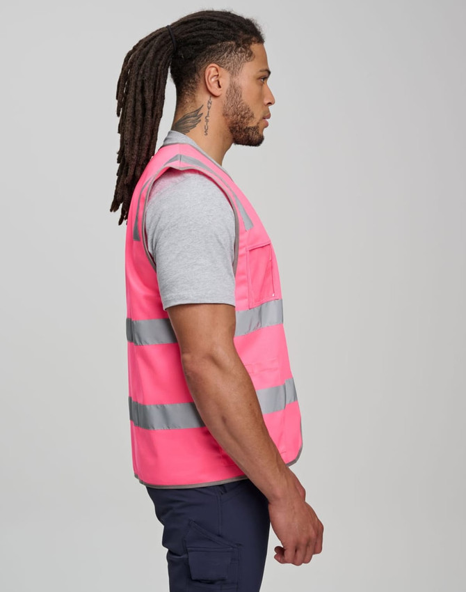 A pink high-visibility safety vest features grey reflective strips and multiple utility pockets. It has a branded logo.