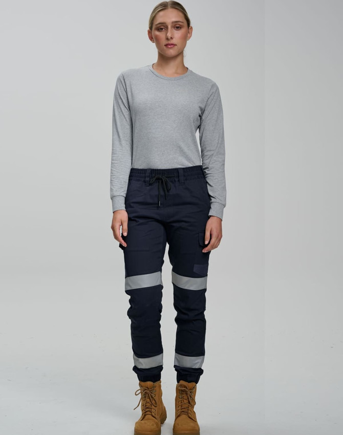 Cotton stretch drill cuffed work pants in navy blue with reflective tape, paired with a grey long-sleeve top.