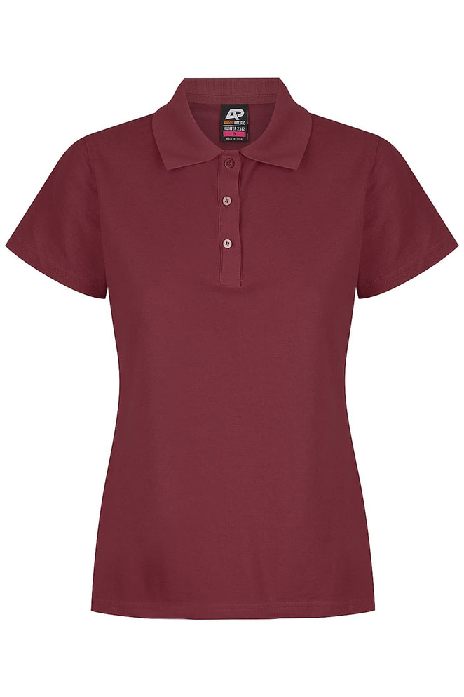 A maroon polo shirt for women with a collared neckline and button placket. Features a branding logo.