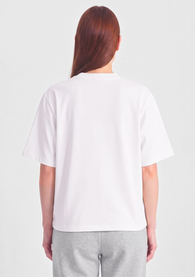 A white box tee with short sleeves, featuring a simple design and a logo on the back.