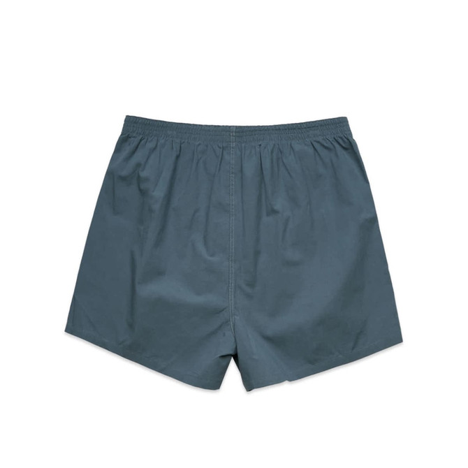 A pair of teal boxer shorts with an elastic waistband, featuring a simple design without additional details.