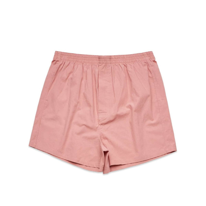 A pair of pink boxer shorts with an elastic waistband, featuring a simple, unadorned design.