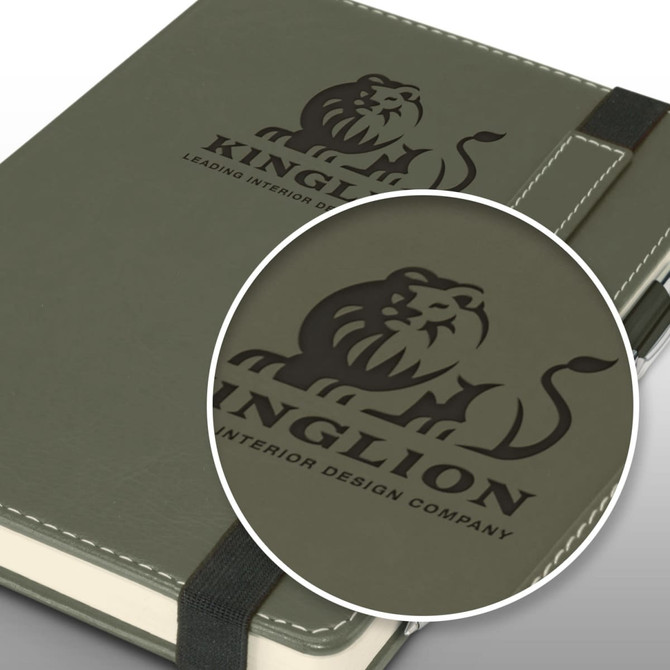 A green notebook with a pen, featuring a logo on the cover and an elastic closure.