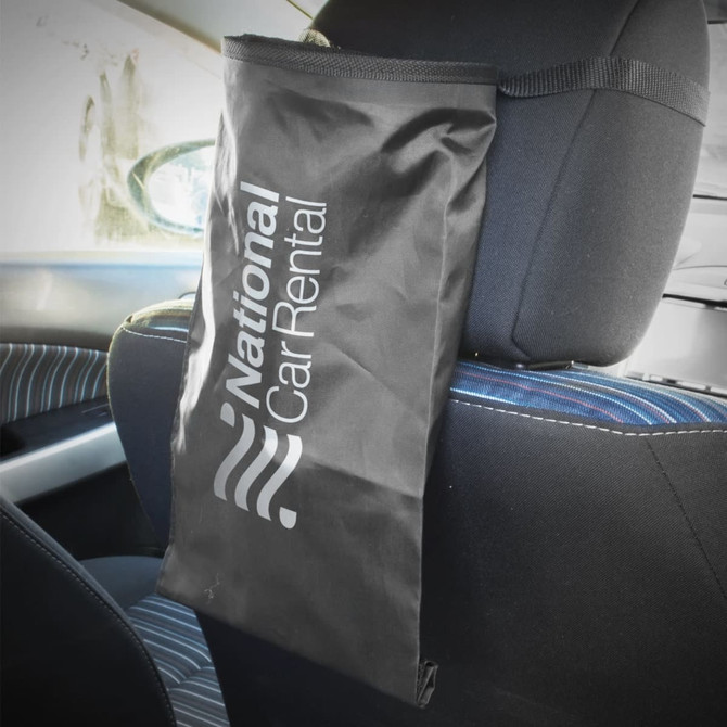 A black car tidy bag with the logo of National Car Rental, designed to hang on the back of a car seat.