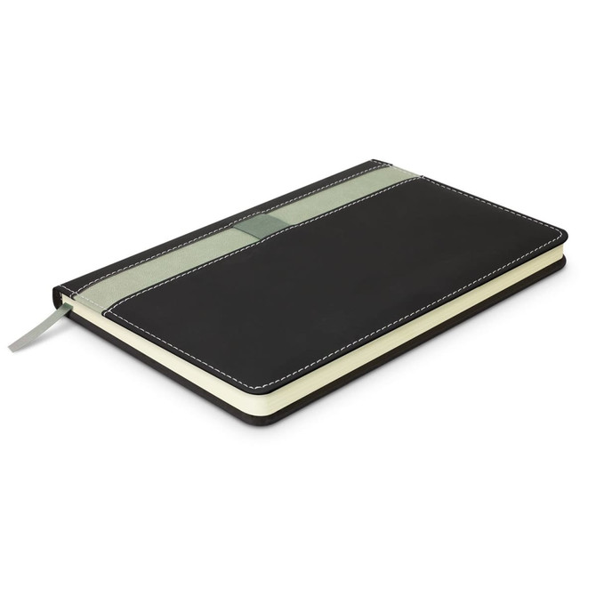 A black Prescott Notebook with a green ribbon bookmark and stitching detailing, featuring a logo on the cover.