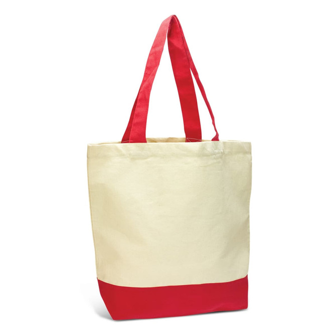 A canvas tote bag in cream with a red bottom and red handles, featuring a logo.