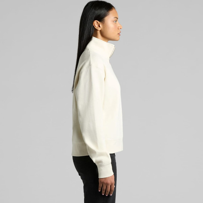 A cream-coloured half zip crew jumper with a relaxed fit and a logo on the side.