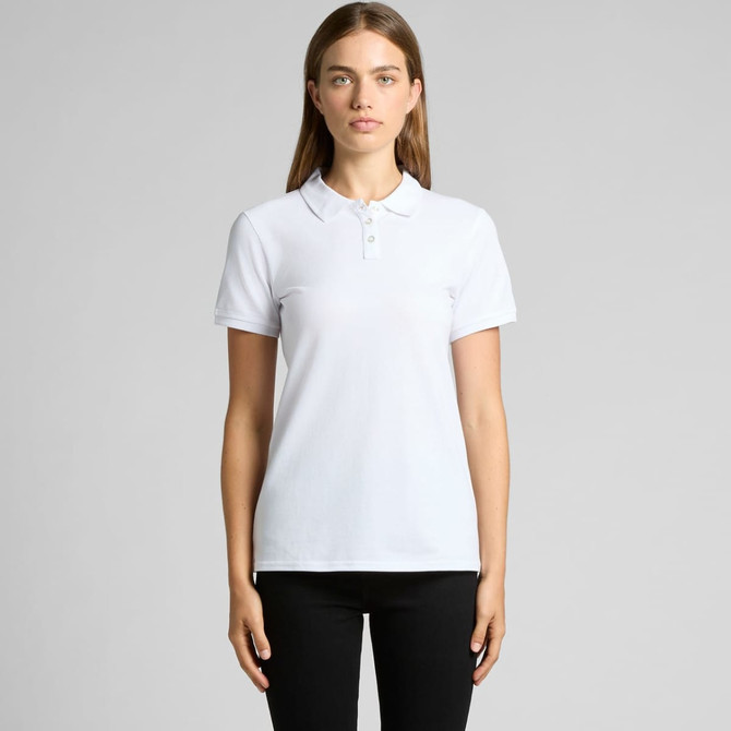 A white polo shirt with a collar and three buttons, displayed on a model against a plain background.