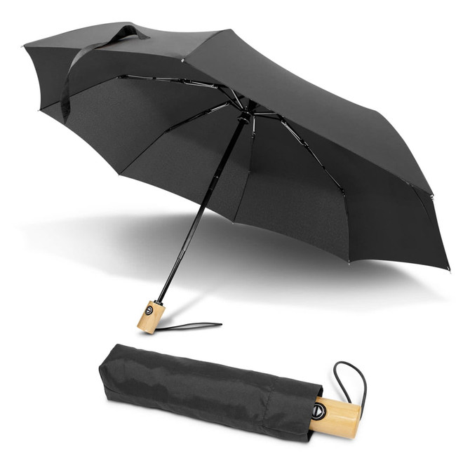 A black compact umbrella with a wooden handle, displayed both open and folded. It features a branding logo.