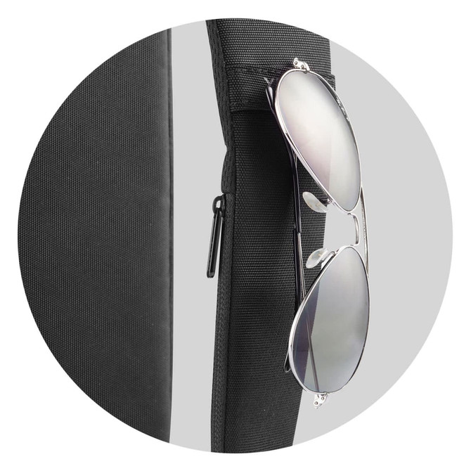 A black product with sunglasses hanging from it, featuring a zippered compartment and a textured surface.