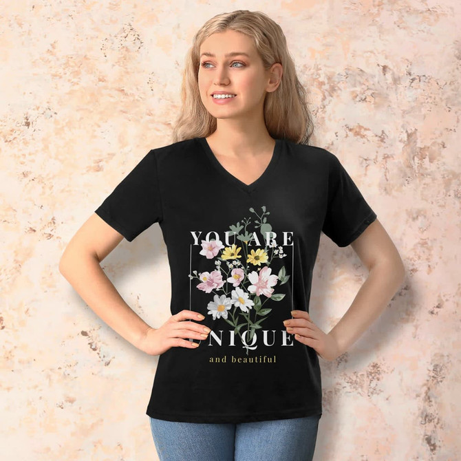 A black women's V-neck T-shirt featuring floral graphics and a motivational quote. The design includes a logo.