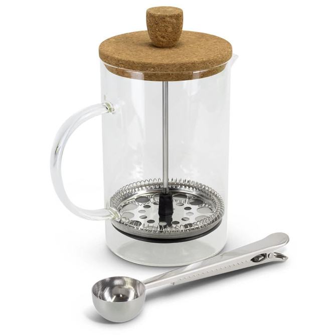 A clear glass coffee plunger with a cork lid, a stainless steel base, and a measuring spoon.